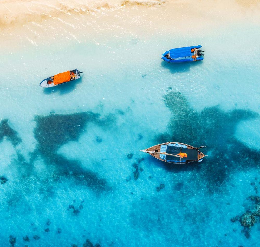 aerial-view-of-the-fishing-boats-in-clear-blue-resize.jpg